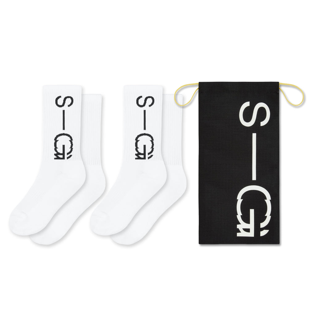 Two white socks with a logo and a black card with the same logo on a white background