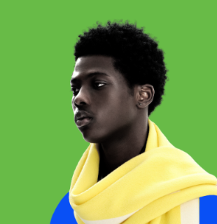Person wearing a yellow and blue scarf against a green background